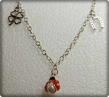 BRACCIALE PORTAFORTUNA CON CIONDOLI FERRO DI CAVALLO-COCCINELLA-QUADRIFOGLIO