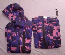 NIKE SPORTSWEAR TUTA ALL OVER