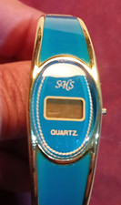 OROLOGIO SCHS-VINTAGE-LCD-AL QUARZO-BRACCIALE RIGIDO-AZZURRO-anni 19801990