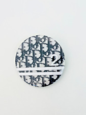 CHRISTIAN DIOR Trotter black monogram logo round pin badge.