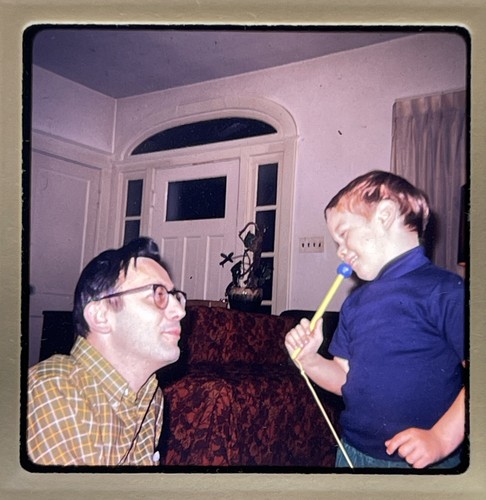 Boy with pretend - boy, microphone