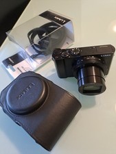 macchina fotografica Lumix 100 con custodia pelle