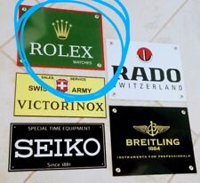 Insegna orologio svizzero