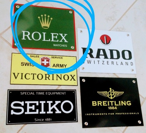 Insegna orologio svizzero