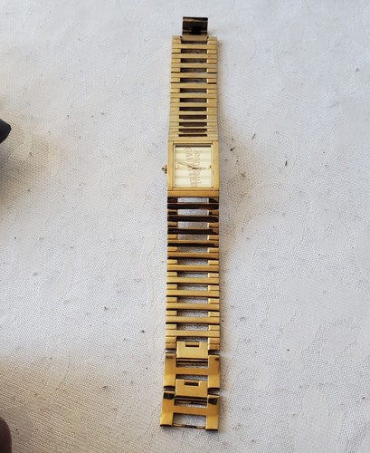 Montre quartz rail dorée - à,