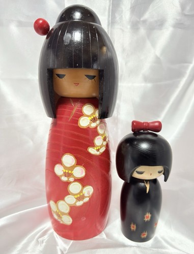 Coppia bambole kokeshi - di,