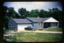 Studebaker Car at a House in