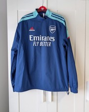 Top ibrido con zip Arsenal
