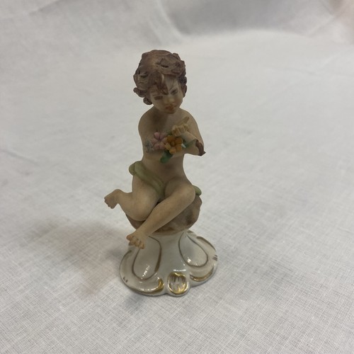 Statuetta bambino con fiori - , in