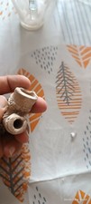 pipa antica in terracotta con volto 