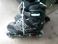 Gently used woman rollerblades
