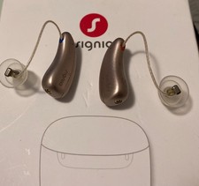 Apparecchi acustici Signia con caricatore portatile