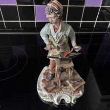 Statuina fabbro porcellana