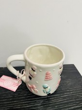 Tazza schiaccianoci e fiocchi