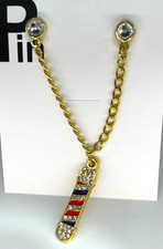 Spilla cappello rosso blu