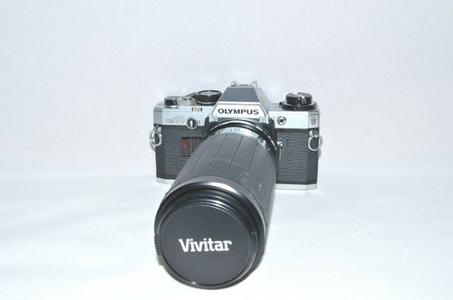 Olympus con zoom - con, di