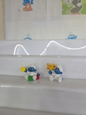 Coppia Baby Puffo Con Dadi E Farfalla