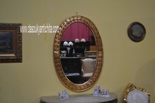 Specchio ovale dorato con