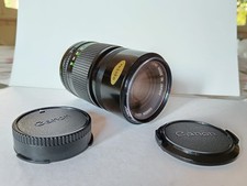 TELEOBIETTIVO CANON FD 135 mm 1:3,5 con paraluce e filtro Lumix