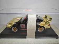 1:24  -Porsche - plastica - oro-nero con teca