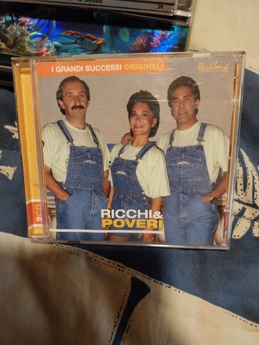 Ricchi poveri i grandi - e,