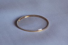 Plastic armed glass gold ring