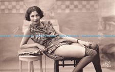 R733346 Woman in Dress Sits on