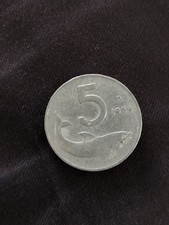 5 lire Delfino 1954 con scritta Romagnoli concava.