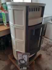 stufa a pellet usata in ottimo stato con rivestimento in maiolica di colore beig