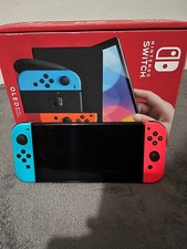 Nintendo Switch OLED Blu/Rosso + Custodia + 4 Giochi + Memoria 256GB