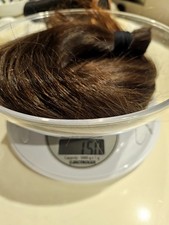 capelli veri, lunghi 50 cm , peso 150 gr.