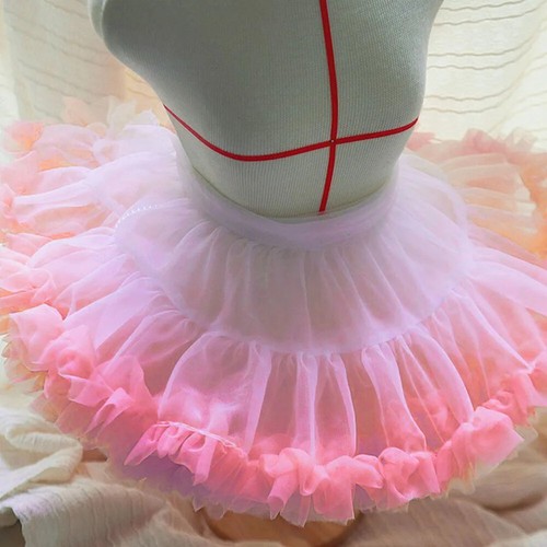 Gonna plissettata orlo tulle
