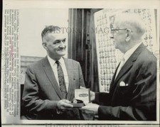 1967 Press Photo St. John Garwood presents watch to Richard Morehead in Austin.