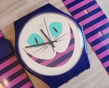 Swatch Maxi MSUOW125 Cat Me Up Alice In Wonderland Wall Clock Pop Art Design 