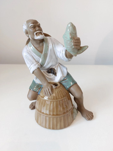 Statuina pescatore mudman