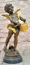Scultura putti batterista