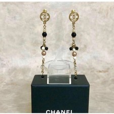 Orecchini CHANEL lunghi qui