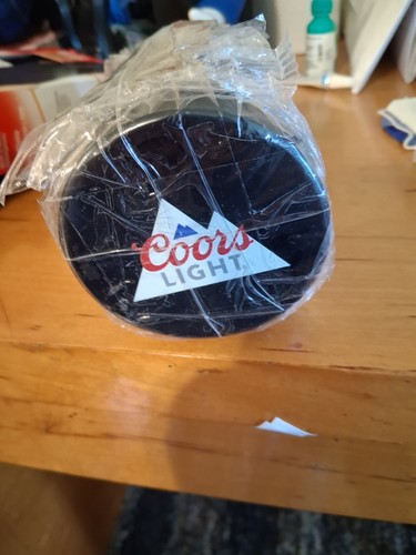 Coors light hockey pucks - light,