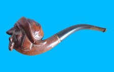 Antica pipa scolpita