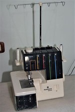 MACCHINA TAGLIA E CUCI 2 AGHI HUSKYLOCK 560 ED FATTA IN GIAPPONE  E GARANZIA!!!