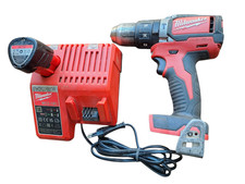 Milwaukee M18 BLPD Trapano + Caricabatterie M12-18 (Non funzionanti)