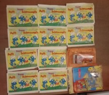 Lotto 10 Bustine Di Figurine Panini Puffi  E 2 Gadget Puffi