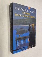 L'UOMO DAGLI OCCHI TRISTI -