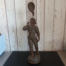 ancienne statue pécheur en