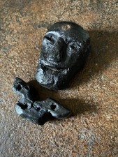 Antica sinistra scultura in