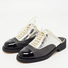Mules Oxford Chanel in pelle