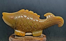 Antica scultura pesce drago