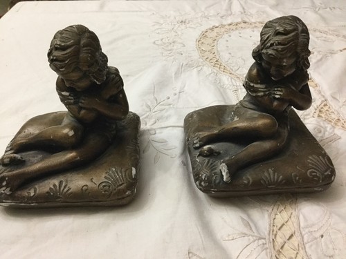 Coppia sculture fermacarte - di,