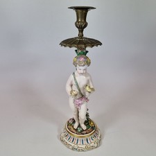 Antico candelabro statuina