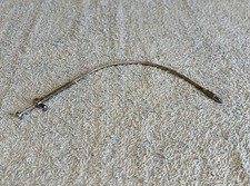 Scatto flessibile con fermo a vite. Lunghezza 23 cm